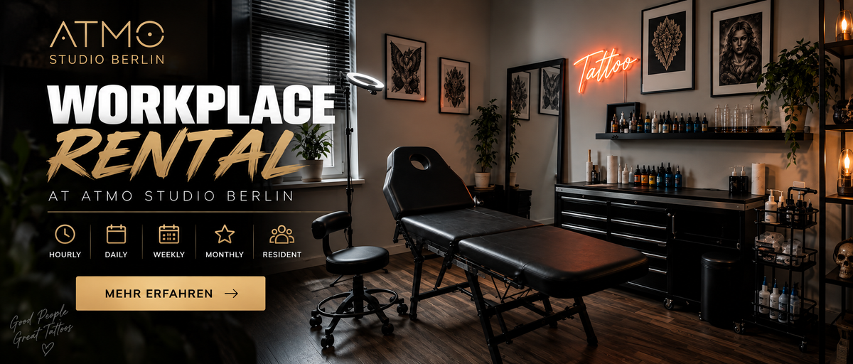 Promotional graphic for a tattoo studio workspace rental, showing a black tattoo bed, chair, shelves with bottles, framed wall art, and a neon tattoo sign in a dimly lit indoor studio environment. Large text reads 'ATMO STUDIO BERLIN', 'WORKPLACE RENTAL', and 'AT ATMO STUDIO BERLIN', with a gold 'MEHR EFAHREN' button.